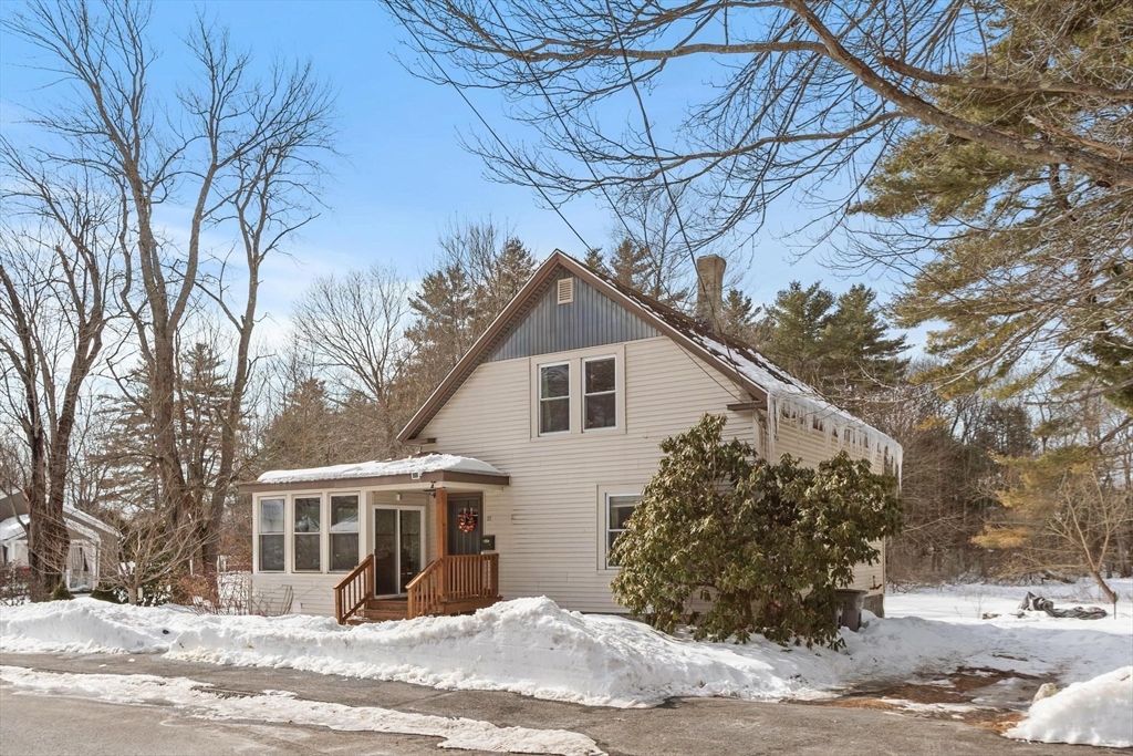 37 Draper Road Gardner, MA 01440 - Photo 4 of 33 a view of a house with a yard covered in snow