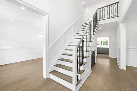 a view of staircase with white walls and a window