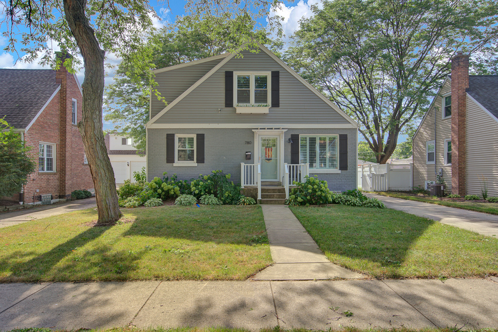 780 Spring Road Elmhurst, IL 60126 - Photo 1 of 42 a front view of house with yard and green space