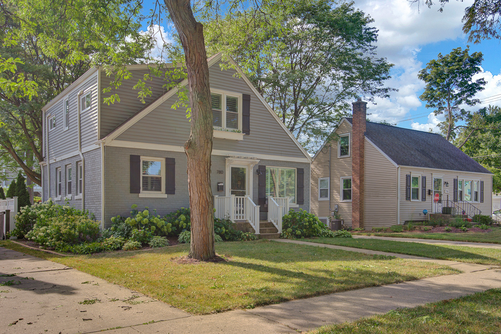 780 Spring Road Elmhurst, IL 60126 - Photo 3 of 42 a front view of a house with a yard