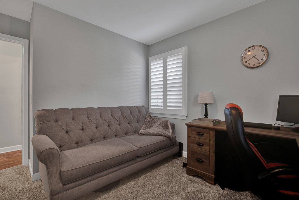 780 Spring Road Elmhurst, IL 60126 - Photo 24 of 42 a living room with furniture a bed and a desk