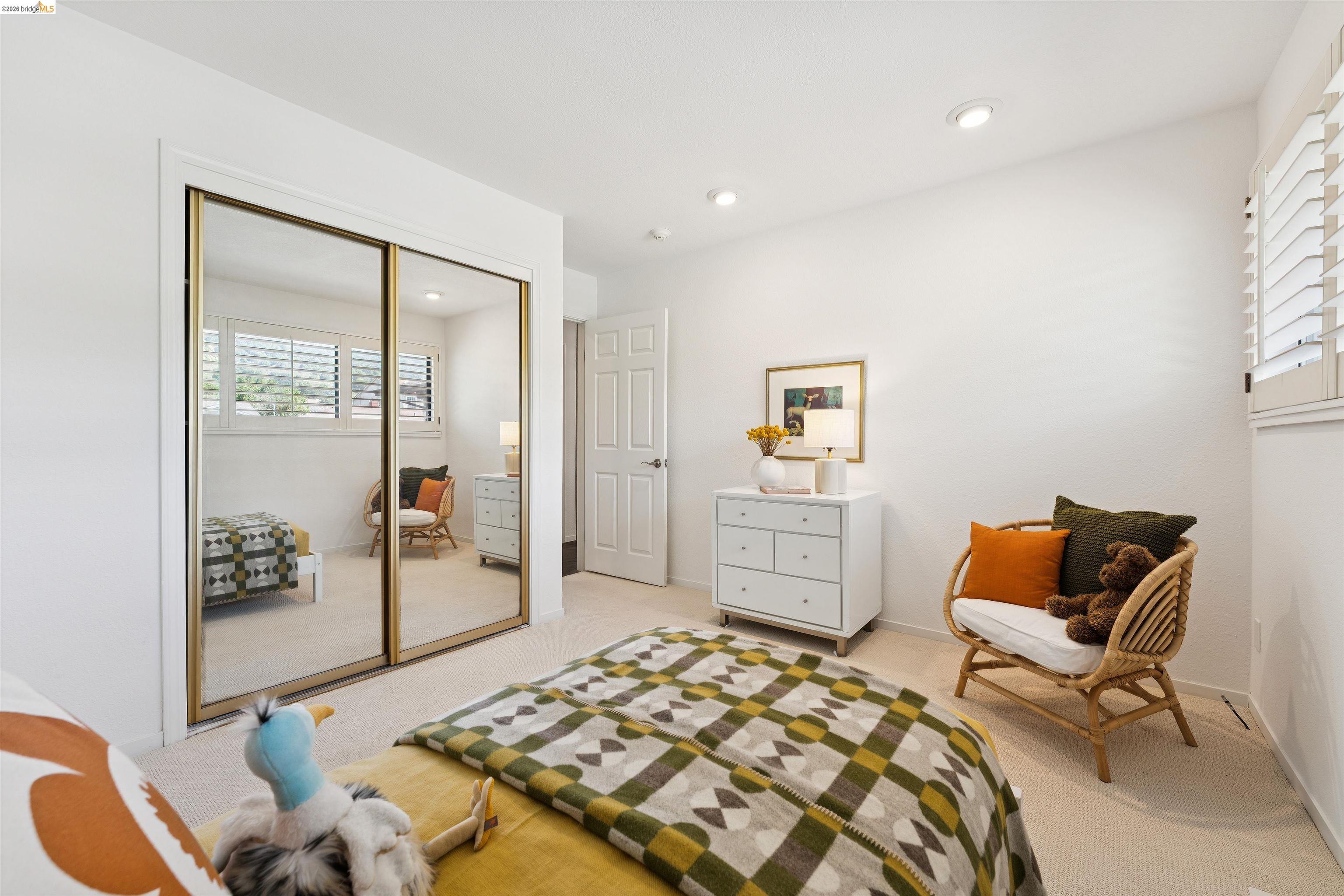 7 Jo Lin Court El Sobrante, CA 94803 - Photo 60 of 99 Light-filled room featuring plush carpet flooring, white walls, recessed lighting, and a window with plantation shutters