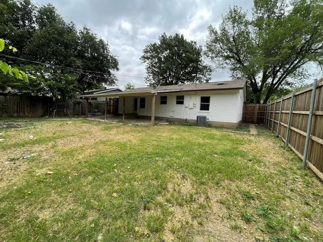 a backyard of a house with lots of green space