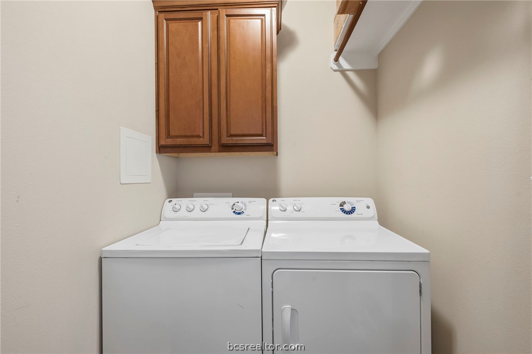 1198 Jones-Butler Road, Unit 703 College Station, TX 77840 - Photo 12 of 45 Separate first floor laundry room comes with washer and dryer plus hanging space and storage cabinets.
