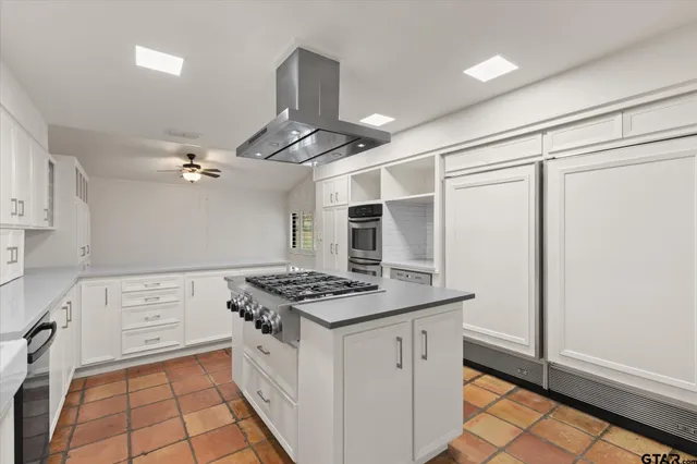 a kitchen with a stove and a microwave