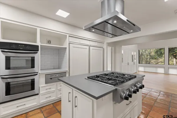 a view of a kitchen with windows