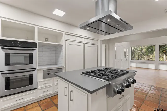 a view of a kitchen with windows