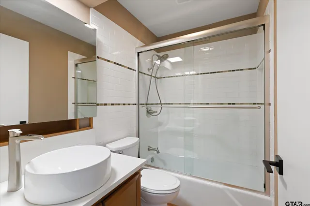 a kitchen with a wooden floor and a sink