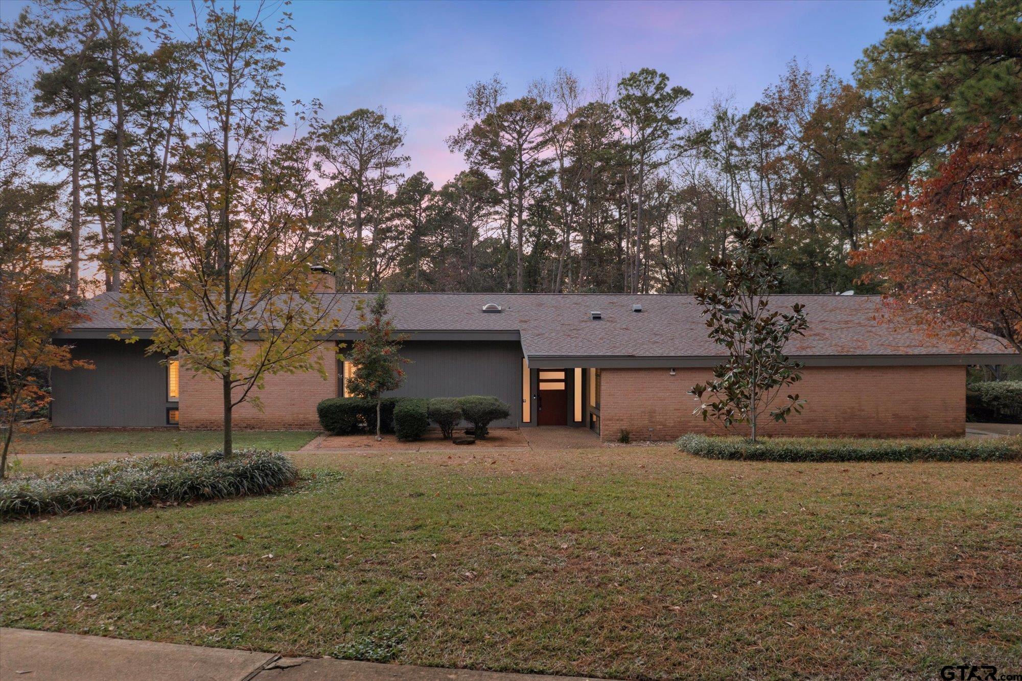6376 Tryon Road Longview, TX 75605 - Photo 2 of 43 a front view of a house with a yard