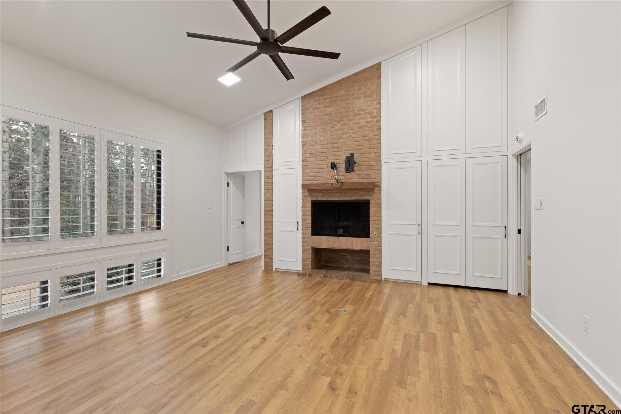 6376 Tryon Road Longview, TX 75605 - Photo 22 of 43 a view of empty room with wooden floor and fan