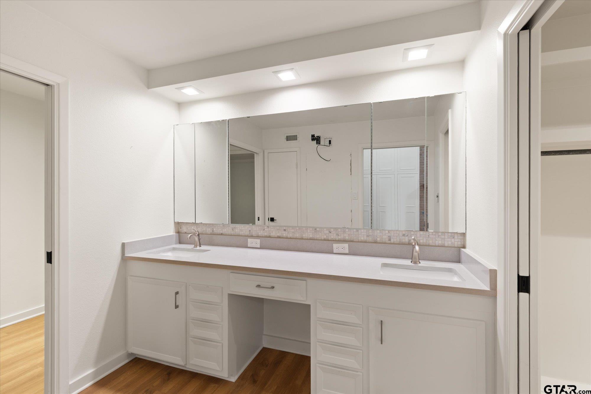 6376 Tryon Road Longview, TX 75605 - Photo 26 of 43 a bathroom with a sink and a mirror