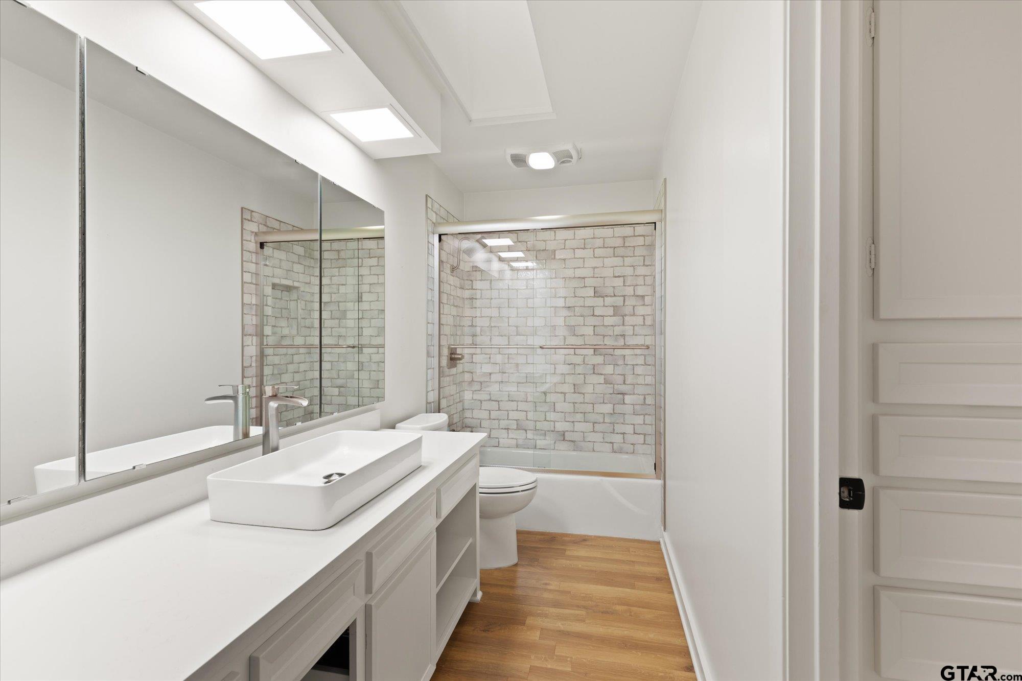 6376 Tryon Road Longview, TX 75605 - Photo 30 of 43 a bathroom with a sink and a mirror