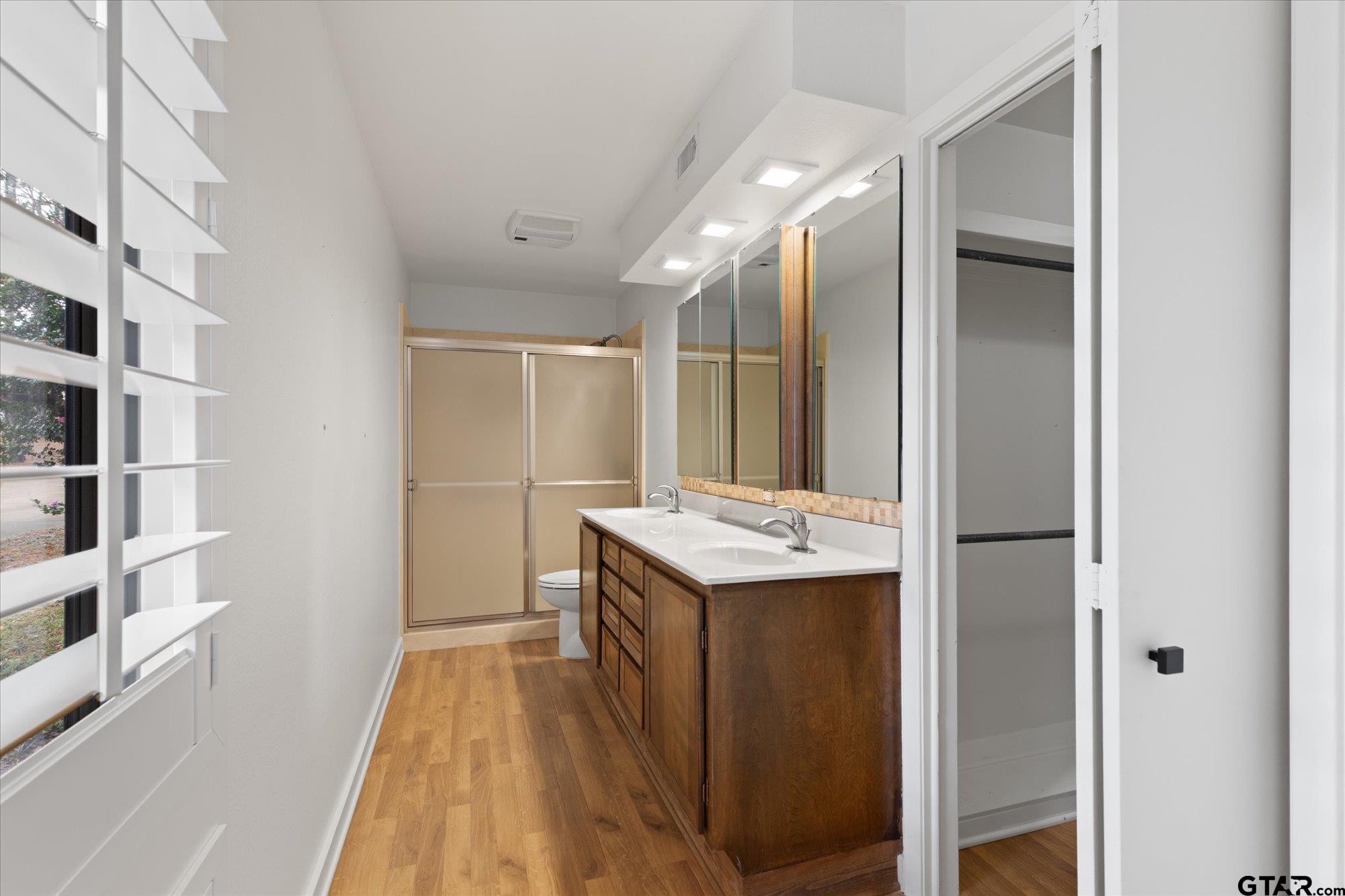 6376 Tryon Road Longview, TX 75605 - Photo 32 of 43 a view of kitchen with stainless steel appliances cabinets and wooden floor