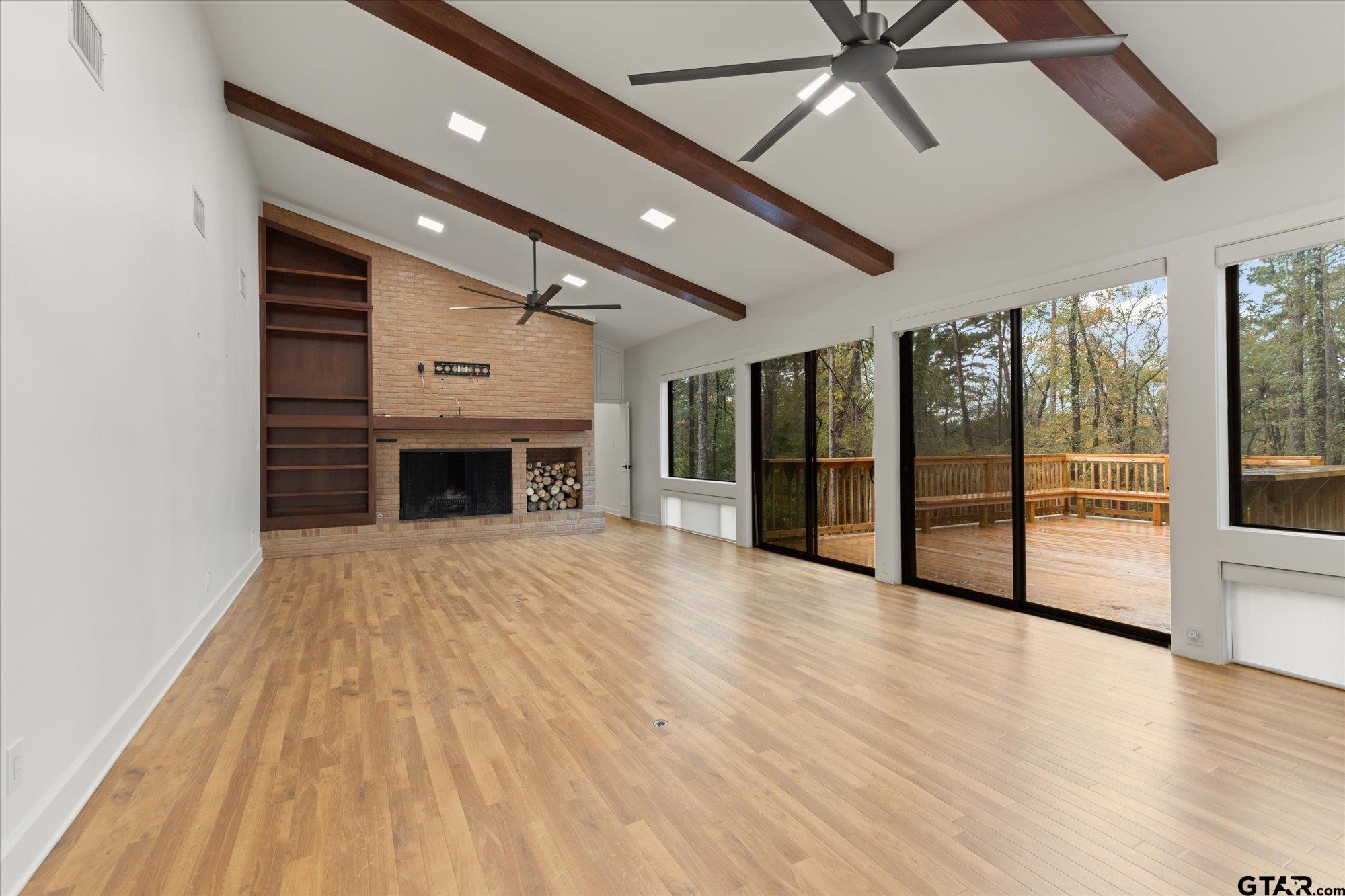 6376 Tryon Road Longview, TX 75605 - Photo 5 of 43 a view of empty room with wooden floor and fireplace