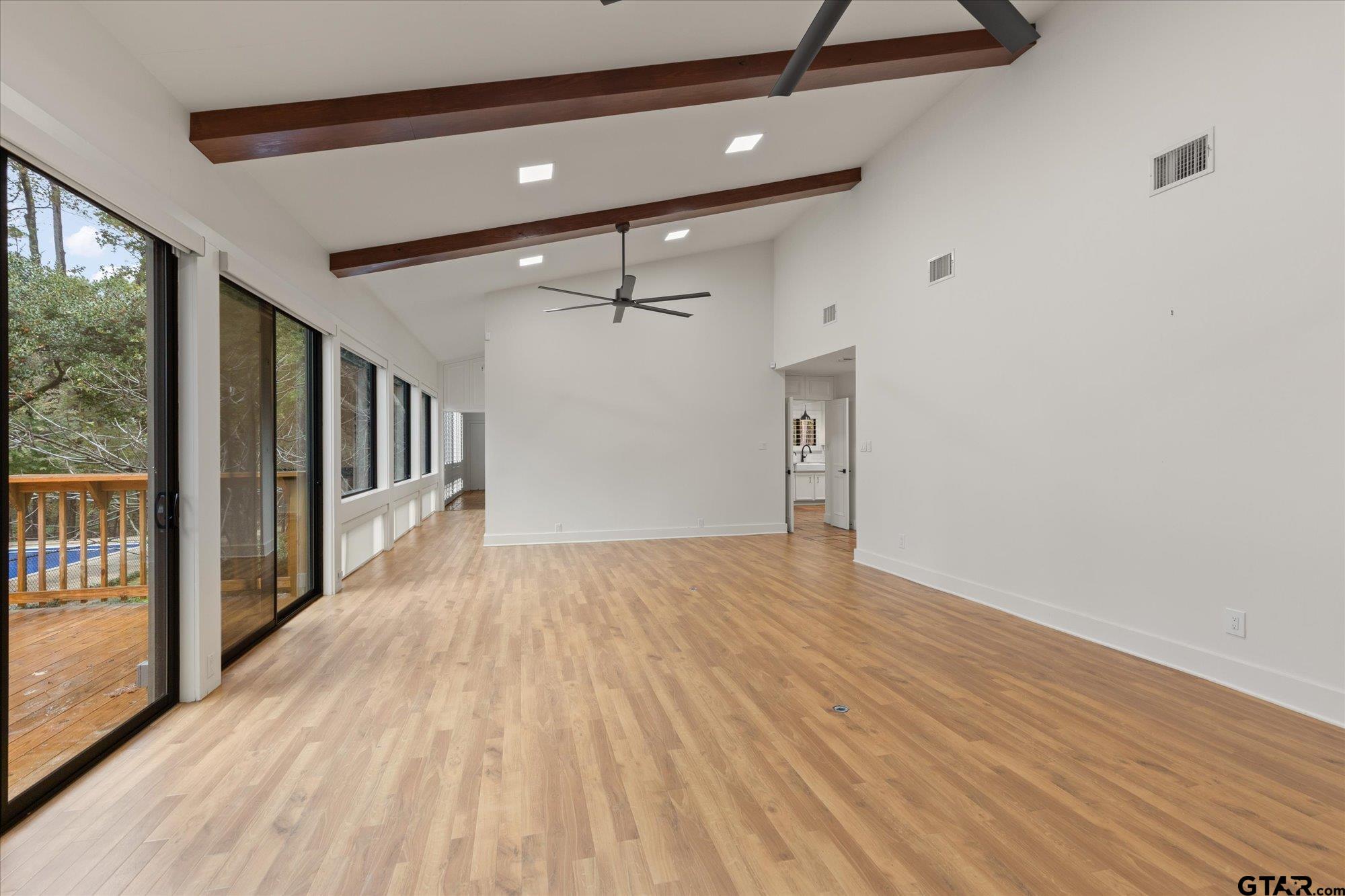 6376 Tryon Road Longview, TX 75605 - Photo 9 of 43 a view of a hallway with wooden floor