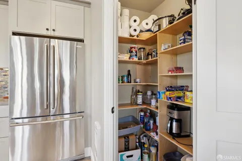 a bed room with a bed and a chair