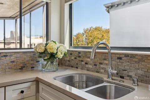 a view of a hallway with washer and dryer