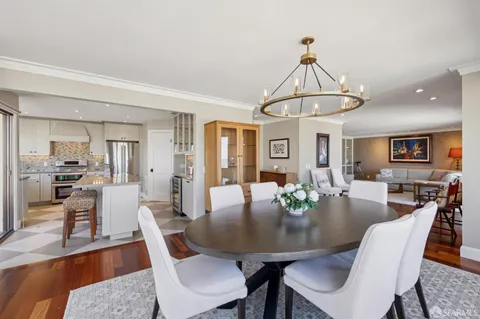 a large bed sitting in a bedroom next to a large window