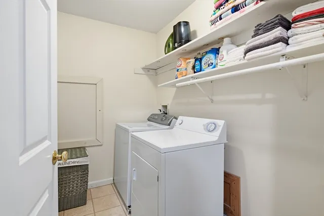 a view of a hallway with furniture and entryway