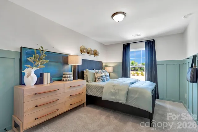 a bedroom with bed and window