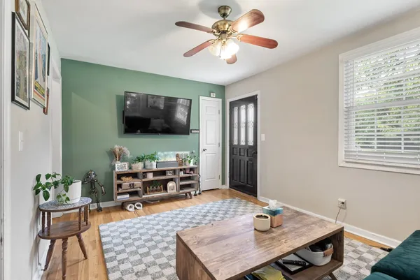 a living room with furniture and a flat screen tv