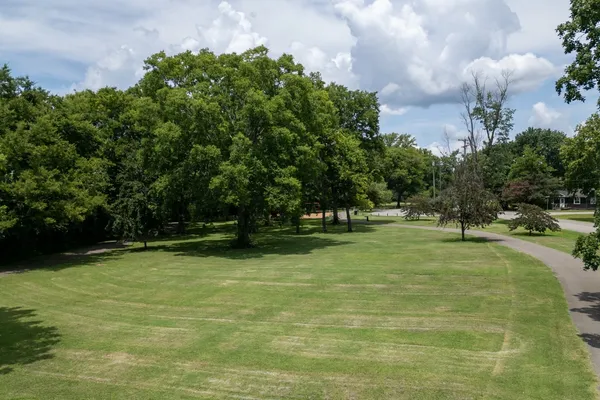 an aerial view of a house with yard