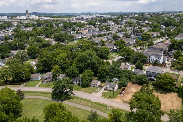 an aerial view of a house with a yard