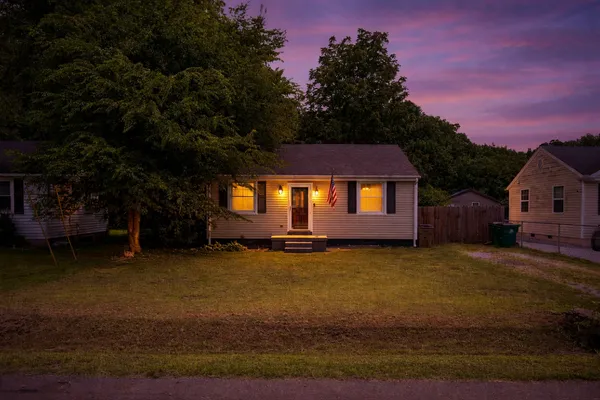 a view of a house with a yard