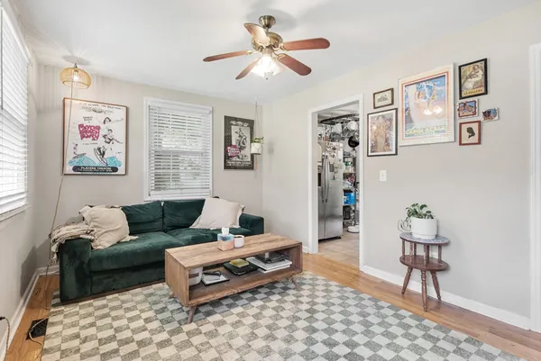 a living room with furniture and a rug