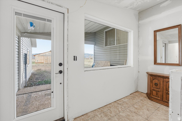 165 Main Street Georgetown, ID 83239 - Photo 25 of 50 Doorway to outside with tile patterned floors