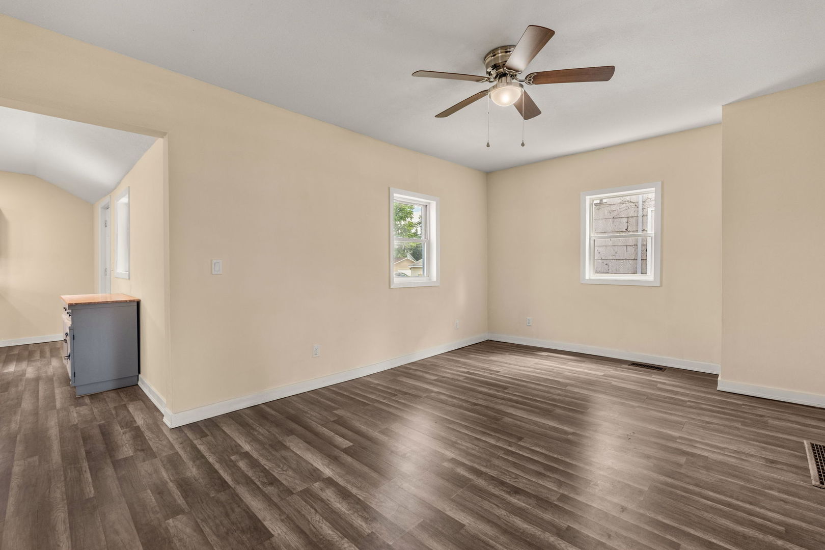 548 7th Avenue South Clinton, IA 52732 - Photo 6 of 23 wooden floor in an empty room with a window
