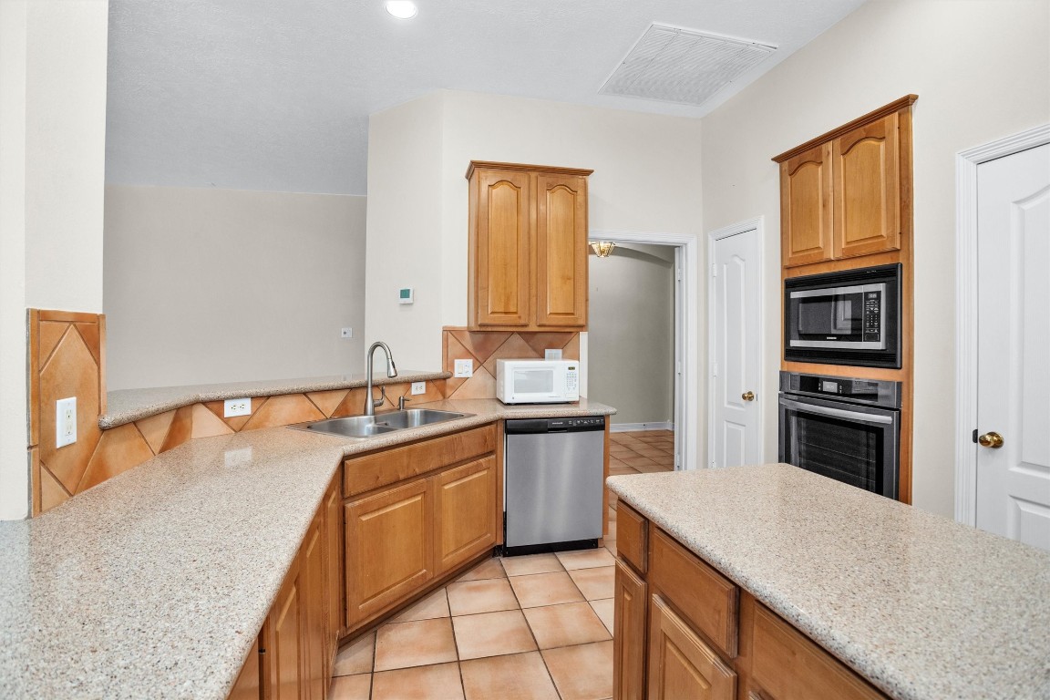 5307 Summerland Ridge Court Houston, TX 77041 - Photo 16 of 35 Electric oven. 2 microwaves.