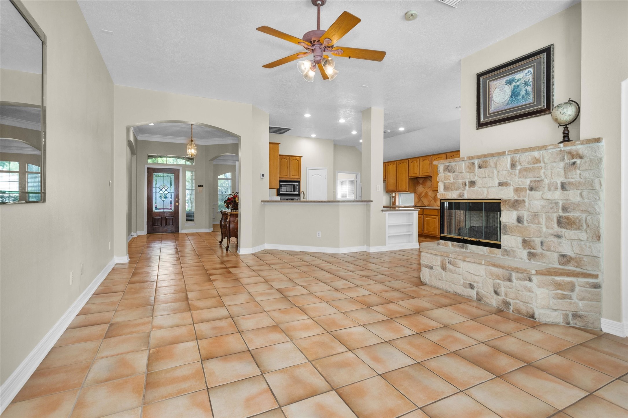 5307 Summerland Ridge Court Houston, TX 77041 - Photo 6 of 35 Open plan living area with living room open to kitchen and separated by a breakfast bar