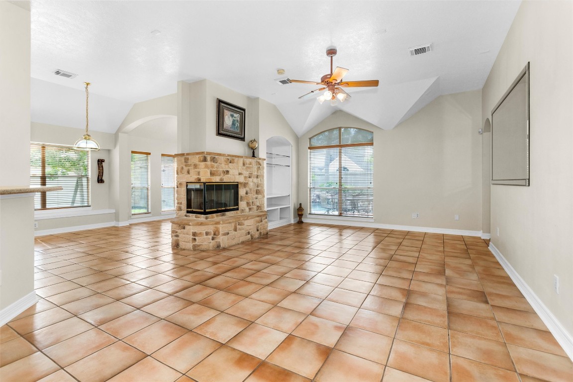 5307 Summerland Ridge Court Houston, TX 77041 - Photo 9 of 35 Breakfast area and sun room on other side of fireplace