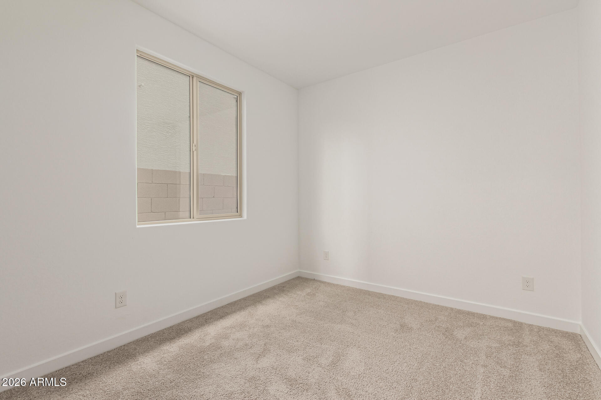 8029 West Granada Road Phoenix, AZ 85035 - Photo 14 of 35 an empty room with windows
