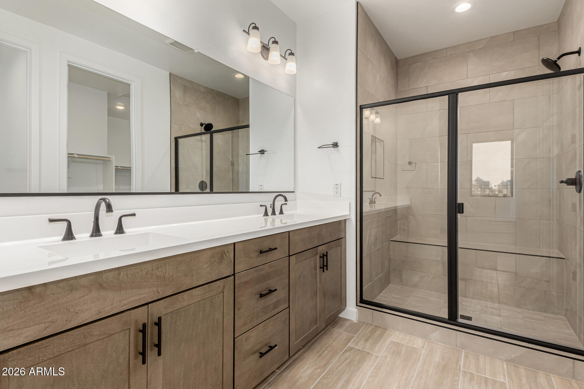 8029 West Granada Road Phoenix, AZ 85035 - Photo 21 of 35 a bathroom with a double vanity sink mirror and shower
