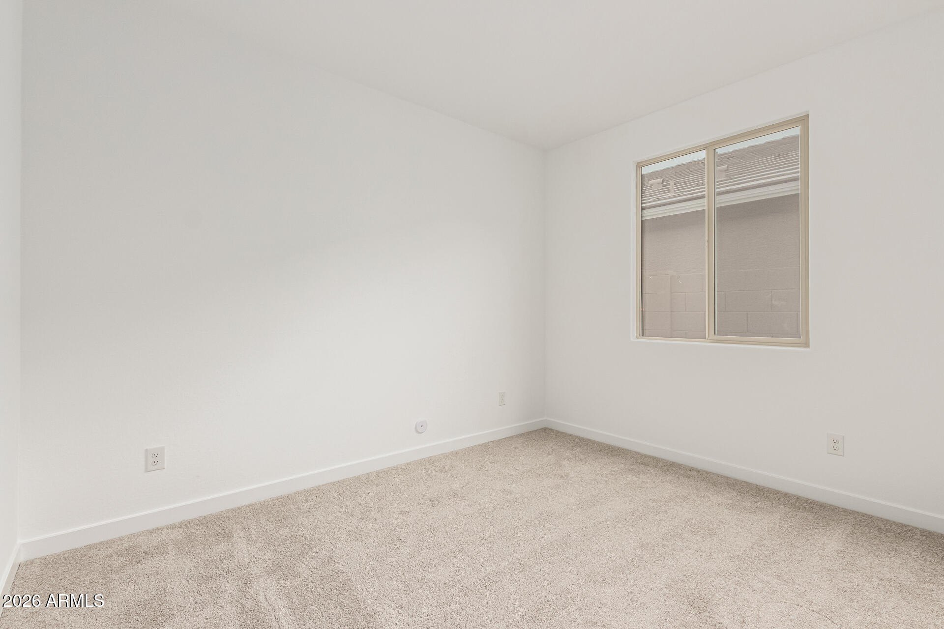 8029 West Granada Road Phoenix, AZ 85035 - Photo 24 of 35 an empty room with a window