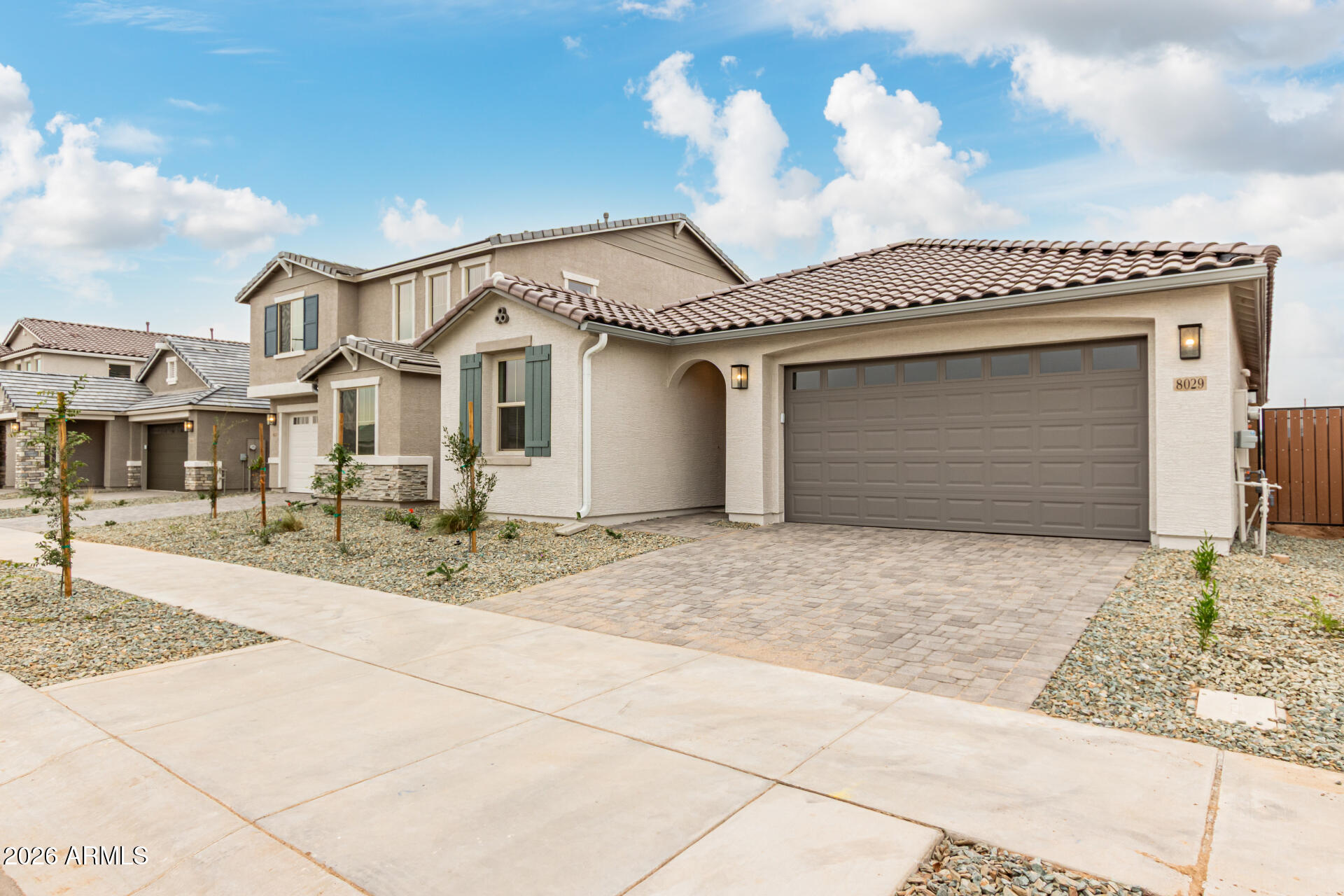8029 West Granada Road Phoenix, AZ 85035 - Photo 31 of 35 a front view of a house with a yard and garage