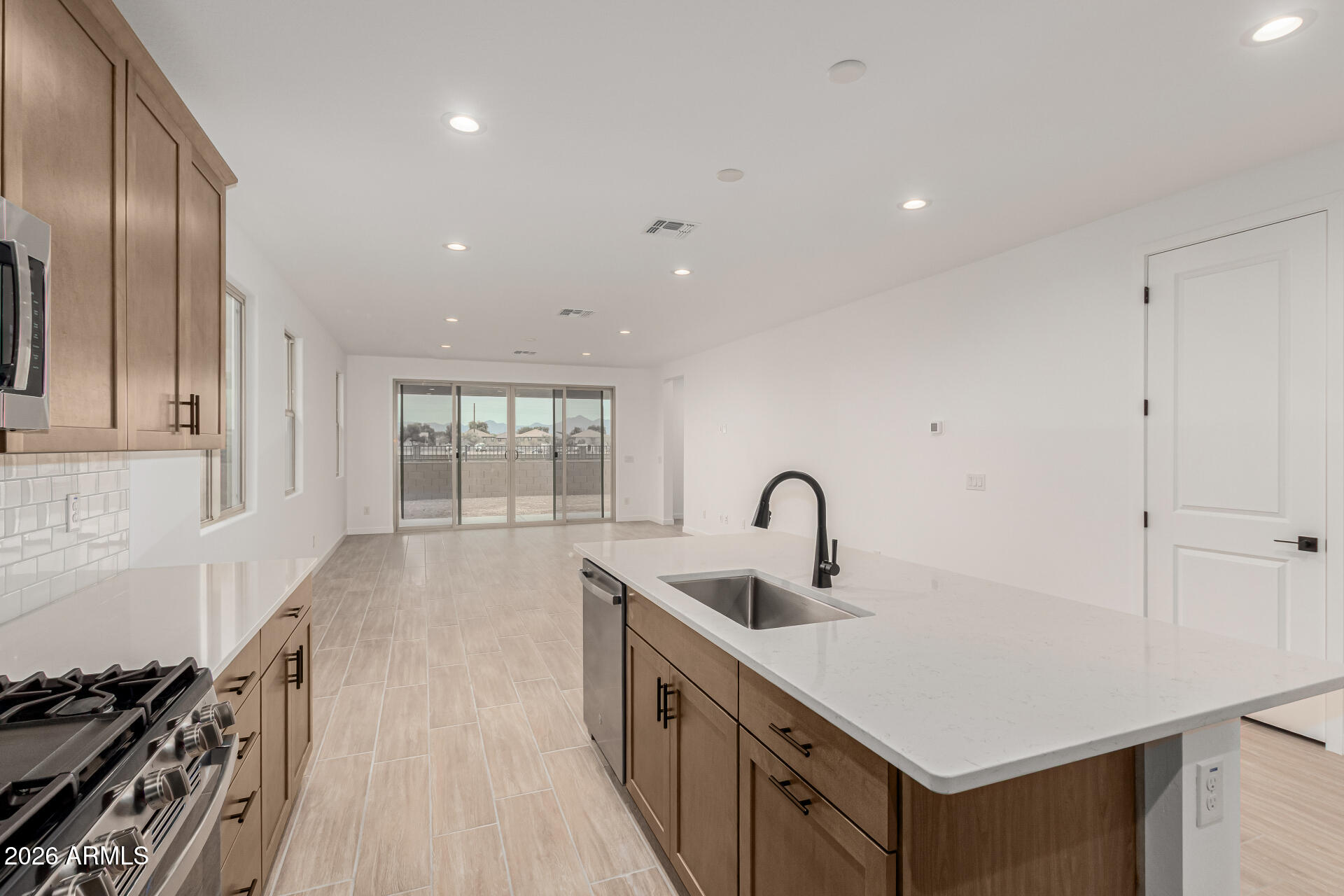 8029 West Granada Road Phoenix, AZ 85035 - Photo 5 of 35 a kitchen with a sink stove and cabinets