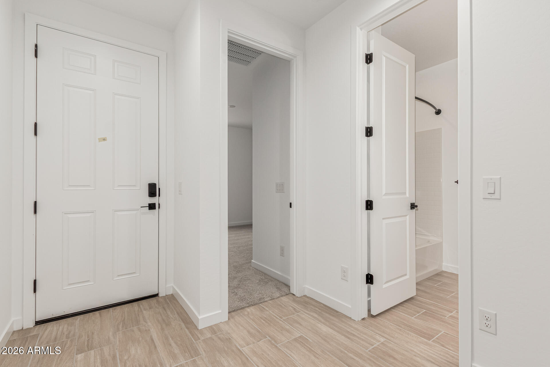 8029 West Granada Road Phoenix, AZ 85035 - Photo 8 of 35 a view of a hallway with wooden floor
