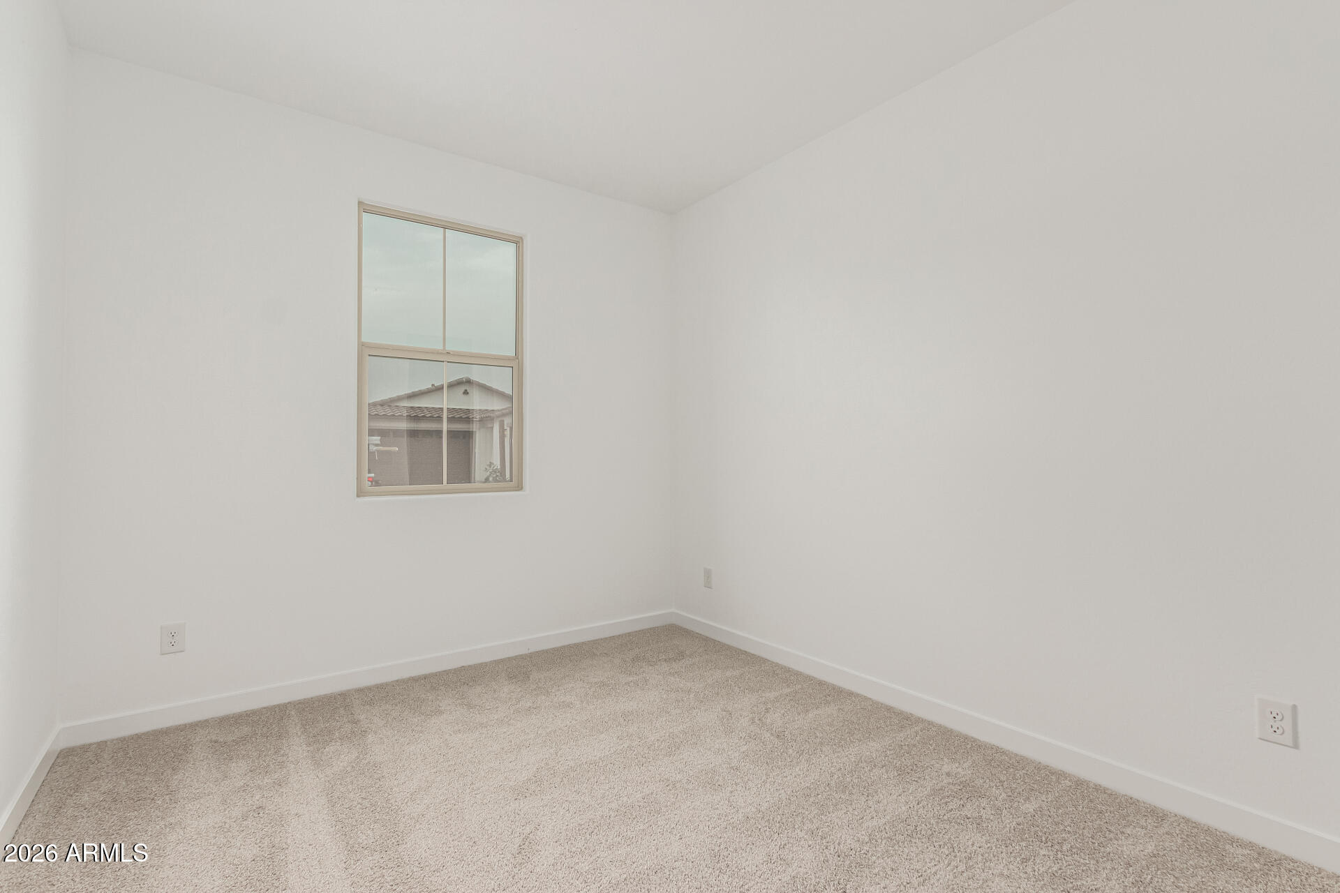 8029 West Granada Road Phoenix, AZ 85035 - Photo 9 of 35 an empty room with a window