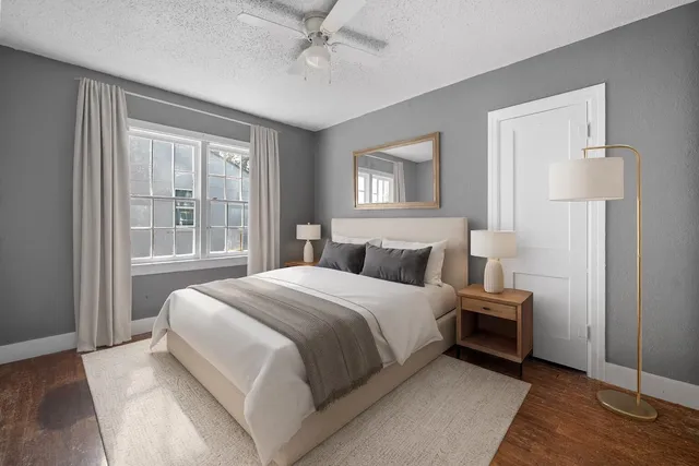 a bedroom with a bed and a window