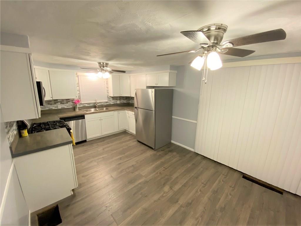 1029 Evergreen Road Pittsburgh, PA 15209 - Photo 7 of 25 Kitchen~ with slider leading to back deck