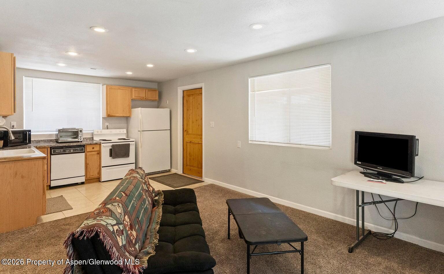 525 Colorado Street, Unit B Craig, CO 81625 - Photo 6 of 10 a view of a workspace with furniture and a window