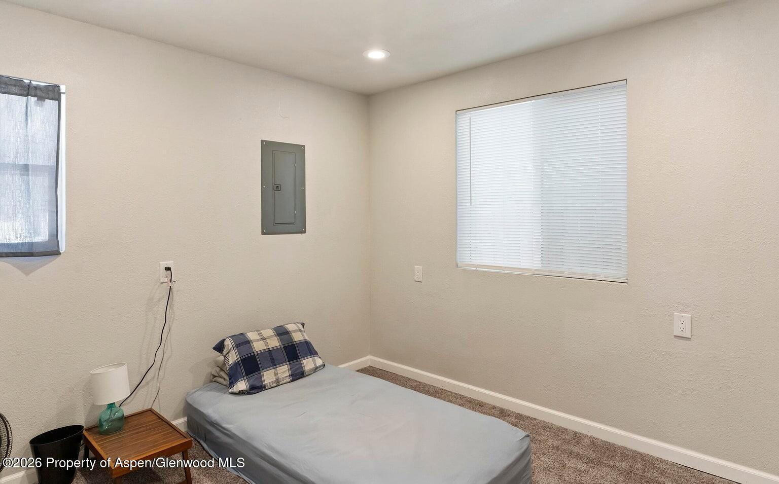 525 Colorado Street, Unit B Craig, CO 81625 - Photo 8 of 10 a room with a table chairs and a window