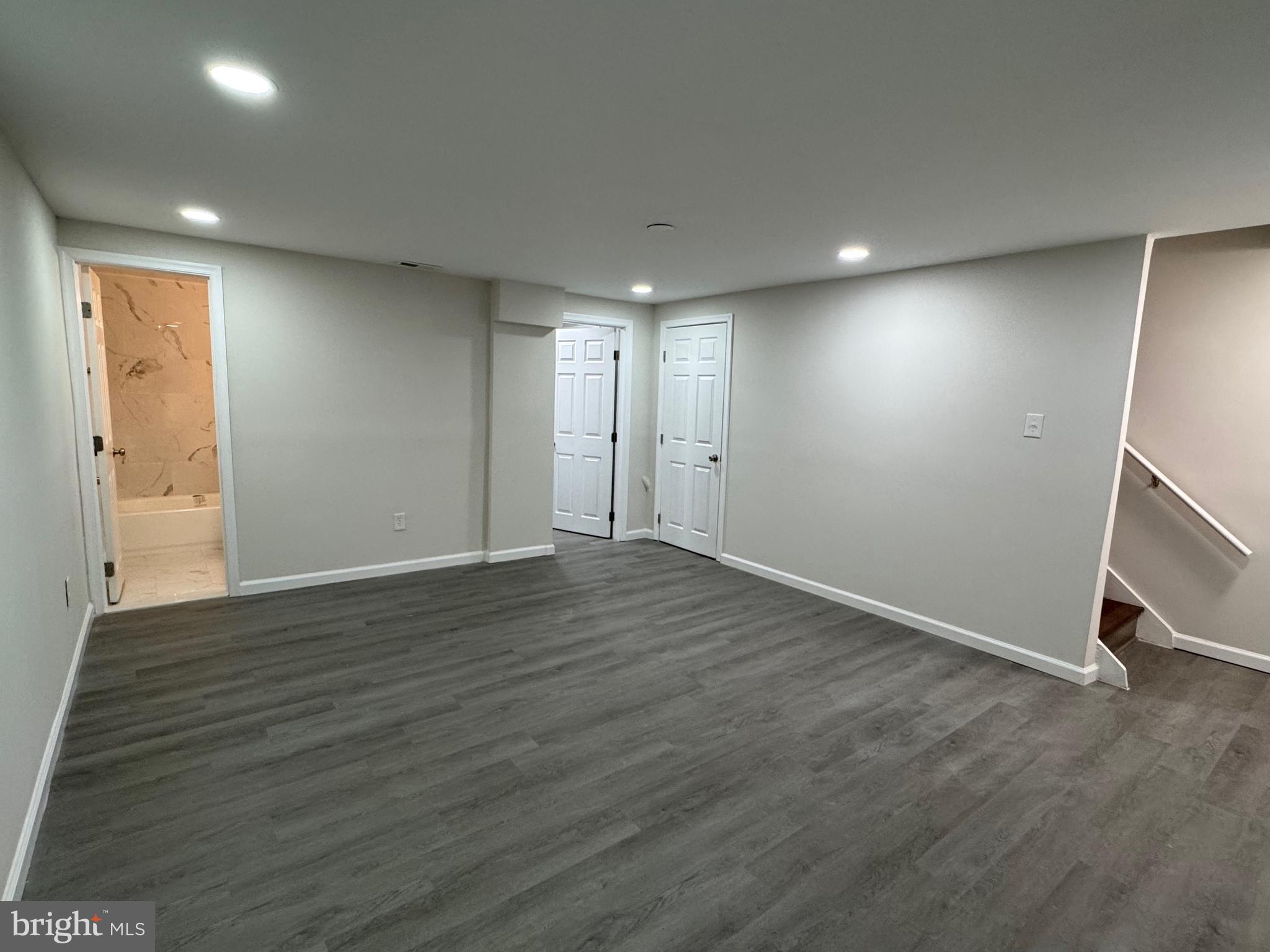 1202 Barnaby Terrace Southeast Washington, DC 20032 - Photo 13 of 21 an empty room with wooden floor and windows