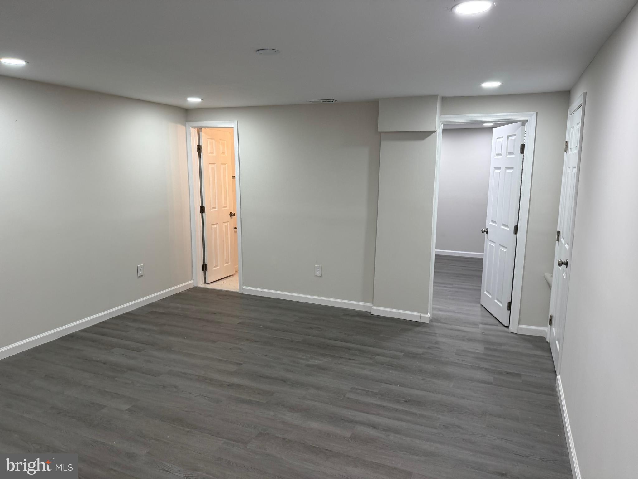 1202 Barnaby Terrace Southeast Washington, DC 20032 - Photo 14 of 21 a view of an empty room with wooden floor