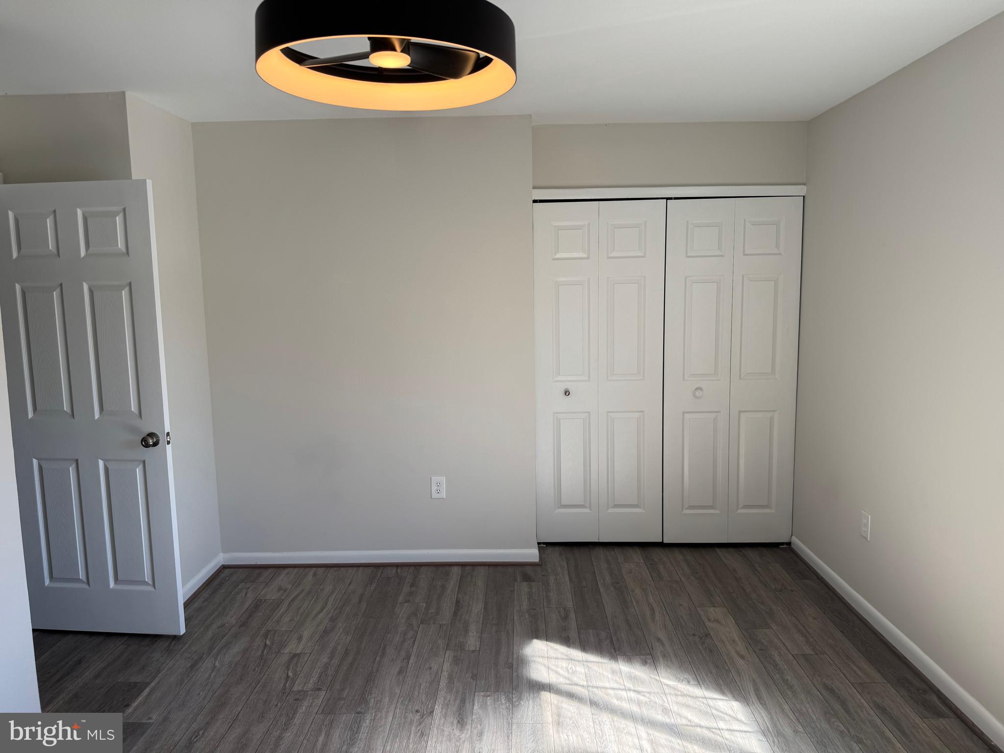 1202 Barnaby Terrace Southeast Washington, DC 20032 - Photo 9 of 21 a view of a room with wooden floor