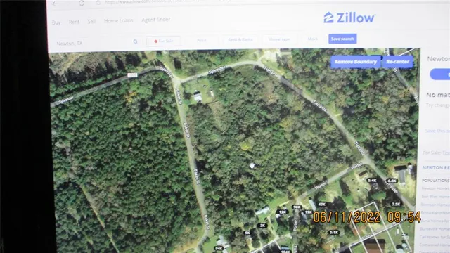 a sign that is sitting on a brick wall