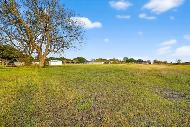 a view of a lake with a big yard